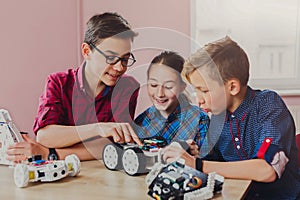 Stem education. Kids creating robots at school