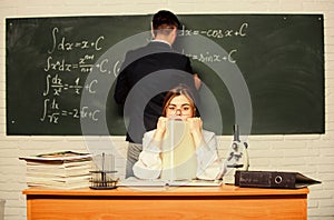 STEM faculty. Man writing on chalkboard math formulas. Teaching in university. High school. University education
