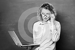 STEM student. Informatics and programming. Teacher notebook searching information chalkboard background. Woman laptop