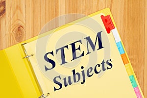 STEM subject type message with file tabs in a yellow binder