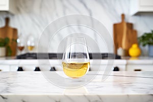 stemless white wine glass on a marble counter