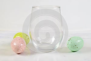 Stemless wineglass mockup with colorful Easter eggs