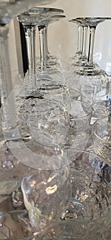 Stemmed glasses in daylight.