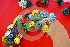 Step 3 - How to make a Christmas wreath from pinecones, cardboard, and a glue gun. New Year`s decor. Creative crafts. Do it yourse