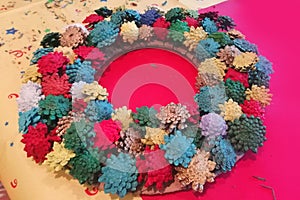 Step 5 - How to make a Christmas wreath from pinecones, cardboard, and a glue gun. New Year`s decor. Creative crafts. Do it yourse
