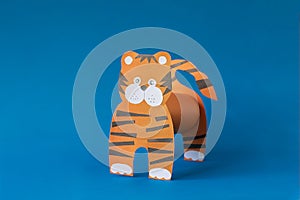 Step 6. Step by step instructions on how to make a tiger at home. Craft for New Year 2022. Take colored paper. A simple