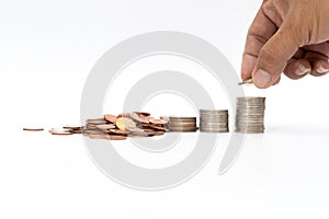 Step of coins stacks and male hand holding coin isolated on white background. , Money saving and investment or family planning con