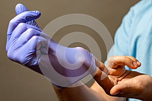 Step of hand throwing away blue disposable gloves medical, Isolated on white background. Infection control concept