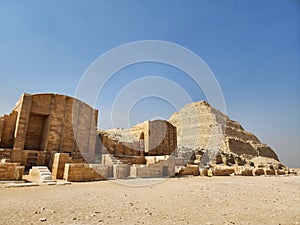 Step pyramids at Saqqara Necropolis in Egypt against the clear blue sky