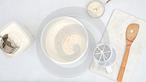 Step by step bread dough recipe. Ingredients for baking needs close up on kitchen table