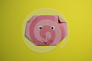 Step by step photo instruction how to make origami paper pig. Simple diy kids children's concept.