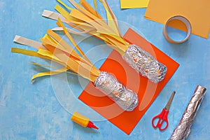 Step by step the production of child crafts to the Cosmonautics Day, rockets from plastic bottles, foil and colored paper. Step