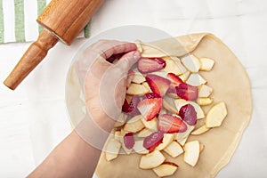 Step by step recipe galette or pie with strawberry. recipe for making biscuits, sweet pastries. Top view with copy space