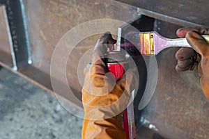 The step two of doing penetrant testing is step to use spray Liquid Penetrant into the brush before apply to the welded for Non-