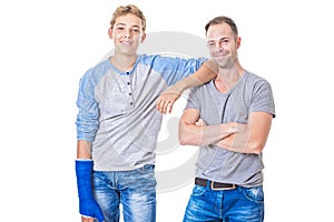 Stepfather and son standing isolated on white background