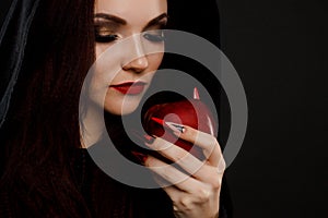Stepmother witch gives poisoned red apple