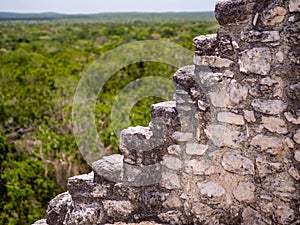 Stepped facade of an ancient Maya temple in Calakmul, Mexico