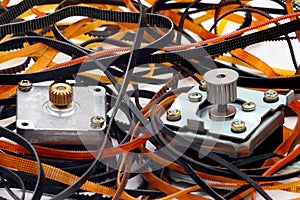 Stepper motors with cogged wheels and belts