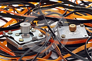 Stepper motors with cogged wheels and cog belts