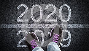 Stepping From 2019 Into New Year 2020 Concept