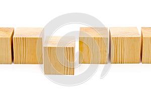 Stepping forward or outstanding concept - row of wood blocks