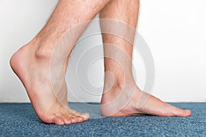 Stepping male feet