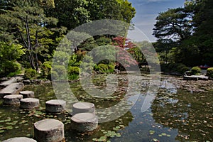 The stepping stone bridge in the pond. Kyoto Japan