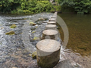 Stepping stones across river Coquet at Rothbury, Northumberland, UK photo