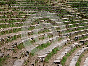 The steps of the ancient amphitheater, overgrown with grass.