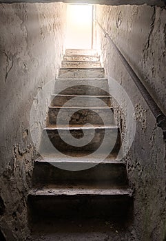 Steps from the dark basement to the light