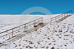 Steps on a high hill lead to the sky