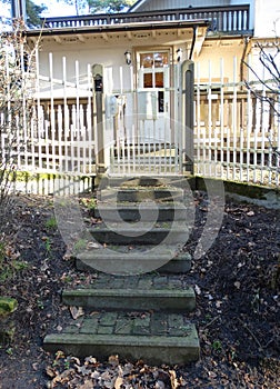 Steps leading to the gate and fence of the house