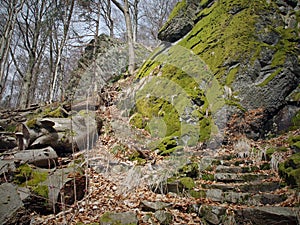 Steps leading up along massive basalt rocks