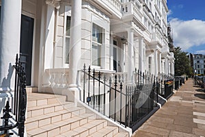 Steps of luxurious property in Pembridge Gardens on sunny day