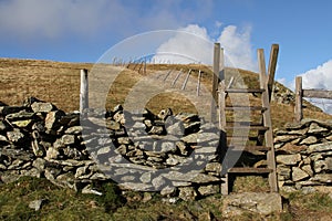 Steps over stone wall.