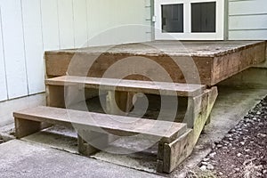 steps and platform of a small wooden porch