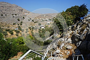 Steps with railings lead to the Church of Prophet Elias. Pefkos or Pefki, Rhodes Island, Greece