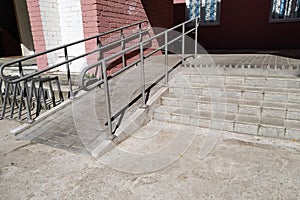 Steps and ramp at entrance to building
