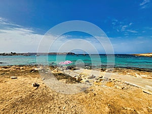 Steps in sand and waves crashing on exotic island. Aerial view on coast of ocean and beach. The amazing sea with tropical blue,