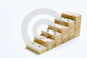 Steps or stair of wooden domino on white background and copy sp