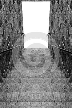 Steps of a stone staircase leading down.
