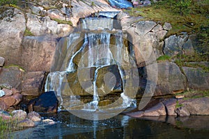 The steps of the waterfall close up. The Putouskalli rock in the Sappoka park. Kotka, Finland