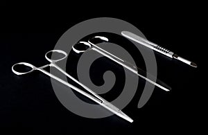 Sterile instruments on a black background close-up. Preparing instruments for surgery