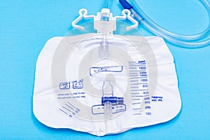 Sterile Urinary Drainage Bag with Anti-Reflux Tower isolated on blue background