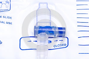 Sterile Urinary Drainage Bag with Anti-Reflux Tower isolated on blue background