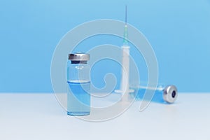 Sterile vial with antivirus. Professional administering a flu vaccine.