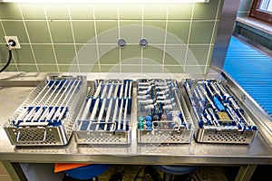 In the sterilization department of a hospital, the instruments for performing a hip prosthesis implantation are prepared