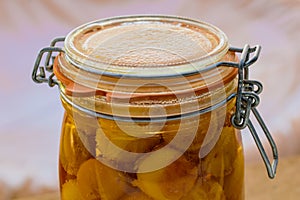 Sterilized mirabelle plums, homemade fruits in syrup for the winter, preserves nutrients