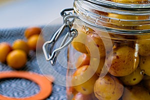 Sterilized mirabelle plums, homemade fruits in syrup for the winter, preserves nutrients