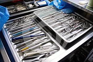 sterilized surgical instruments carefully arranged on sterile tray